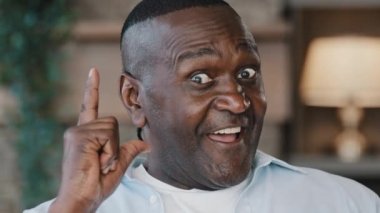 Male african adult creator genius clever brainy man grandfather come up with idea create super plan good decision find answer open mouth in delight emotion expressing fantasy inspiration feel eureka