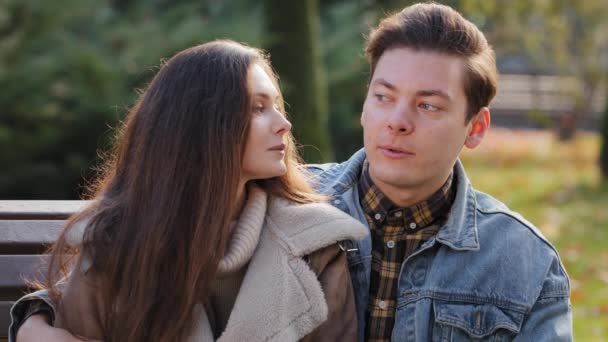 Two Young People Couple Lovers Sit Together Bench Park Handsome — Vídeo de stock