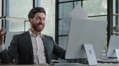 Excited motivated middle-aged happy businessman throw papers documents up in office man worker celebrate corporate success achievement freedom at Friday enjoy project victory winning luck triumph win