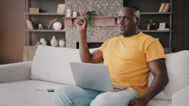 African american man writer creative freelancer create strategy for business startup think decision commenting aloud gesticulating answering incoming mobile call talking to client discussing new idea