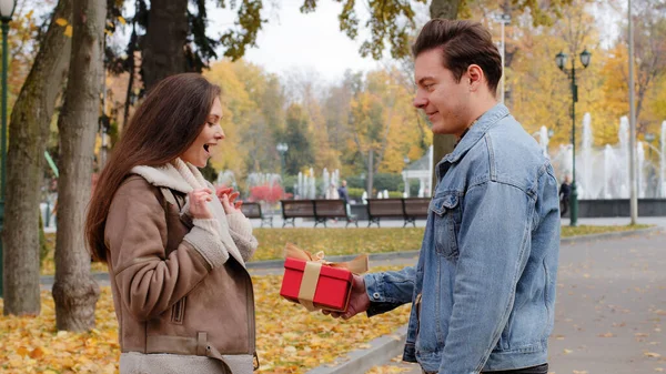 Caucasian Boyfriend Give Red Box Small Gift Gold Ribbon Lovely — Stok fotoğraf