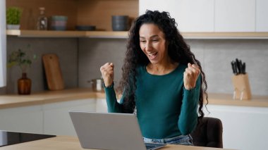 Happy excited female winner freelancer lucky housewife businesswoman shopper rejoice internet victory online bet lottery win discounts feel euphoria enjoyment have fun celebrate triumph wow reaction