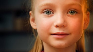 Portrait cute caucasian little preschool girl daughter toddler pretty talented kid friendly female face beautiful blonde baby with green eyes smiling looking at camera happy small child enjoy holidays