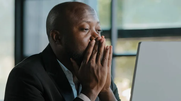 Tired stressful african male adult sad businessman feel tiredness discomfort eyestrain fatigue pain from hard overwhelmed computer work massaging dry irritable eyes exhaustion unwell health concept