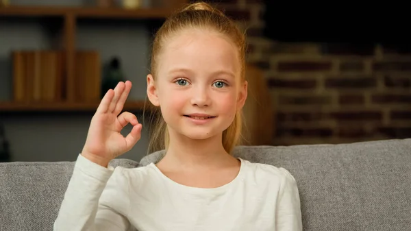 Portrait Caucasian Happy Child Girl Smiling Kid Sitting Sofa Room — Stockfoto
