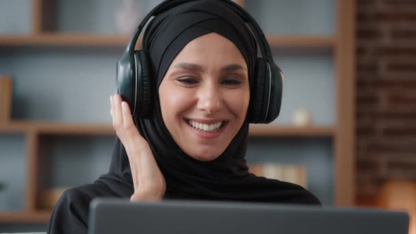 Muslim Islamic Woman Black Hijab Wearing Headphones Headset Listening Musing — Stock Video