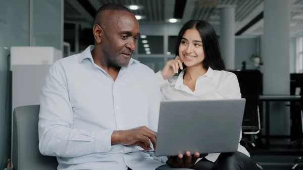 Diverse Colleagues Two Business Partners African Arabian Workers Discuss Internet — Stockfoto