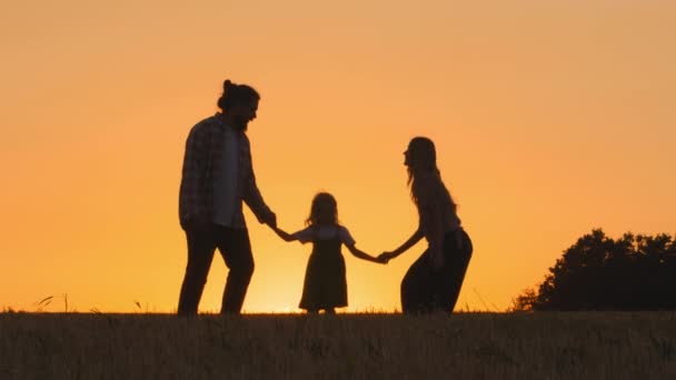 Three Silhouettes Happy Carefree Cheerful Family Parents Mother Father Daughter — Stock Video