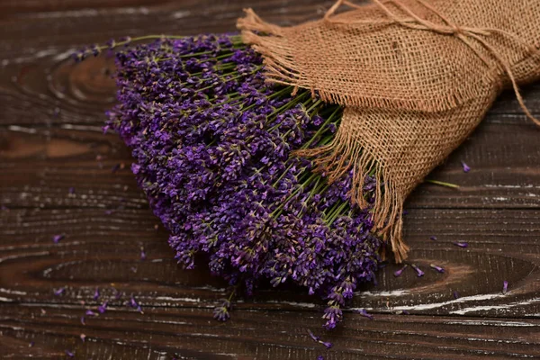 lavender bouquet on rustic wooden board, on old wood