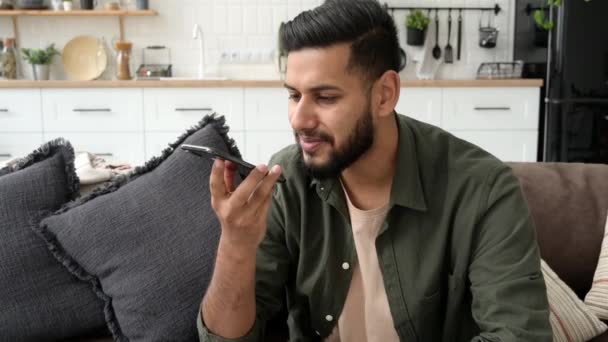 Positive Indian Arabian Young Man Casual Wear Sit Sofa Cozy — Vídeo de Stock