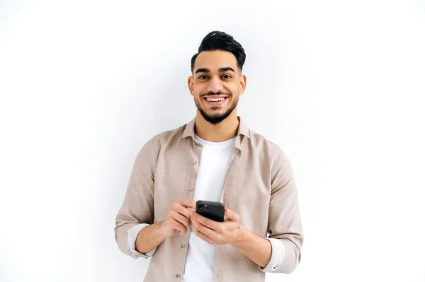 Handsome Positive Arabian Indian Modern Guy Holding Smartphone His Hands — 스톡 사진