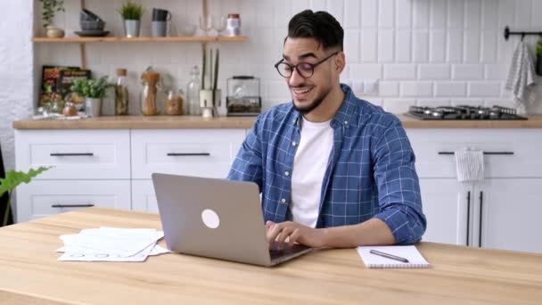 Relaxed Calm Arabian Indian Guy Freelancer Works Home Sits Kitchen — Wideo stockowe