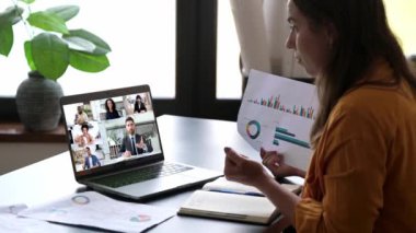 Multiracial business people on a laptop screen. Caucasian clever woman, company coworker, having online financial brainstorm via video conference with successful colleagues, discuss financial plan
