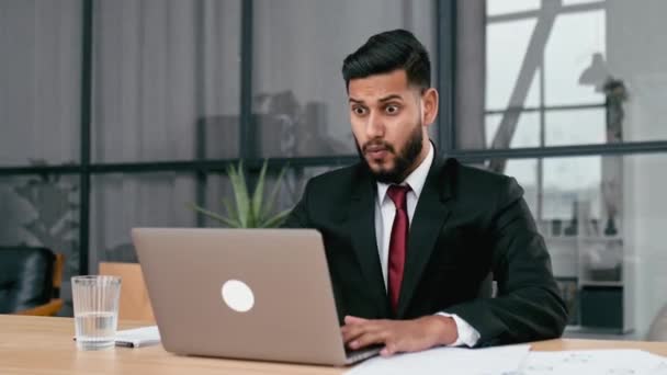 Excited Indian Arabian Businessman Suit Sits Modern Office Looking Laptop — Video Stock