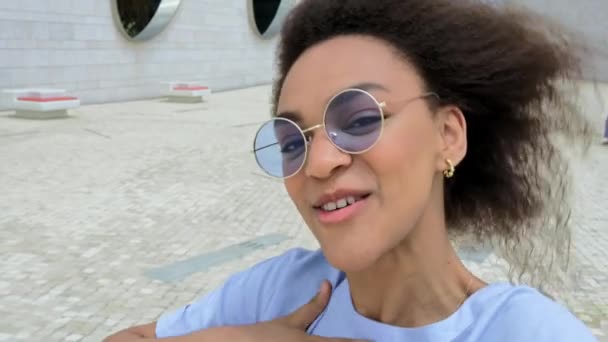 Fashionable Modern Joyful African American Curly Haired Girl Blue Glasses — Vídeo de Stock