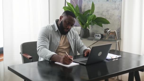 Focused Successful Smart African American Male Student Manager Sitting Desk — Stock video