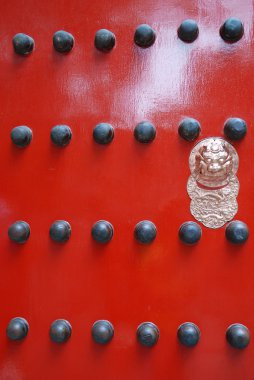 Red chinese door with a lion head. clipart