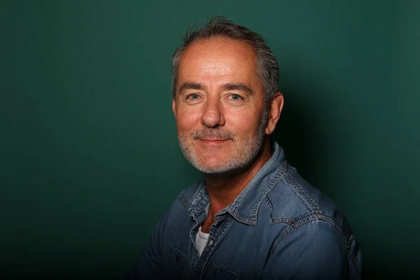 stock image Portrait of a beautiful happy man in front of a colored background