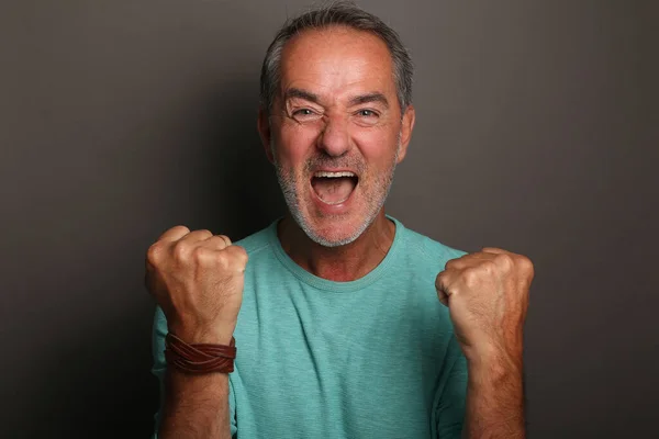 Portrait of a beautiful happy man in front of a colored background — Stock Photo, Image