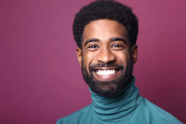 Portrait of a beautiful happy man in front of a colored background — Stock Photo, Image