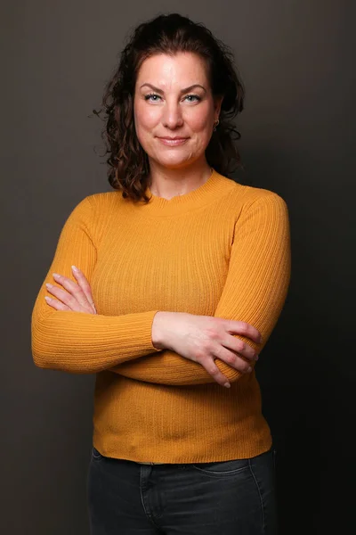 stock image Portrait of a beautiful happy woman in front of a colored background