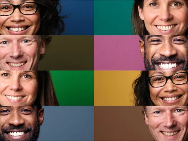 Pessoas felizes bonitas na frente de um fundo — Fotografia de Stock