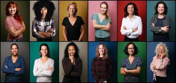 Schöne glückliche Frauen vor einem Hintergrund — Stockfoto