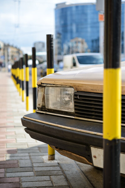 Protective barrier made of yellow striped columns