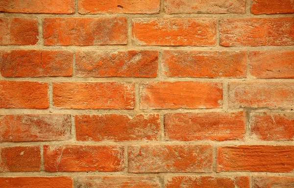 Detailní záběr oranžová cihlová zeď — Stock fotografie