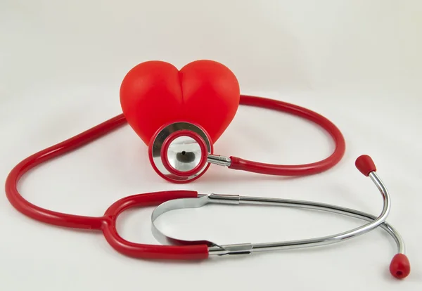 Red stethoscope and red heart — Stock Photo, Image