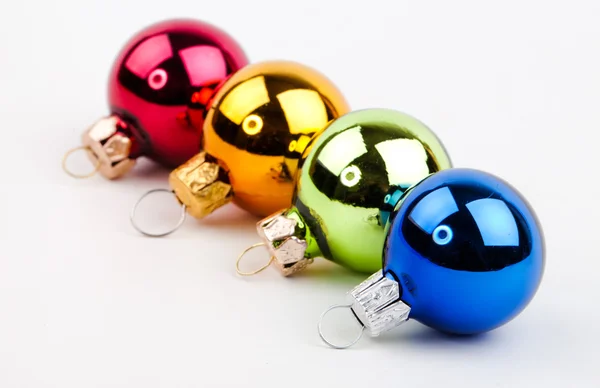 Cuatro bolas de Navidad de colores —  Fotos de Stock