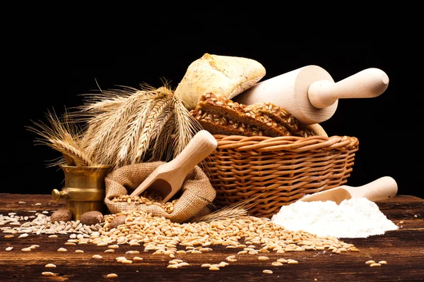 Baked bread on wooden table — Stock Photo, Image