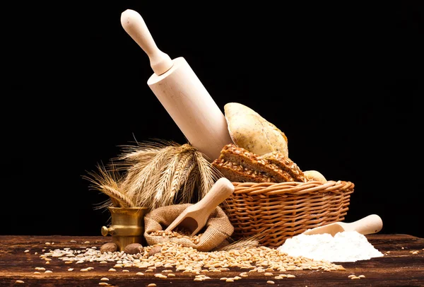 Baked bread on wooden table — Stock Photo, Image