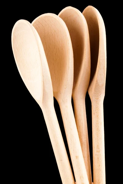 Wooden Spoons isolated on black background — Stock Photo, Image