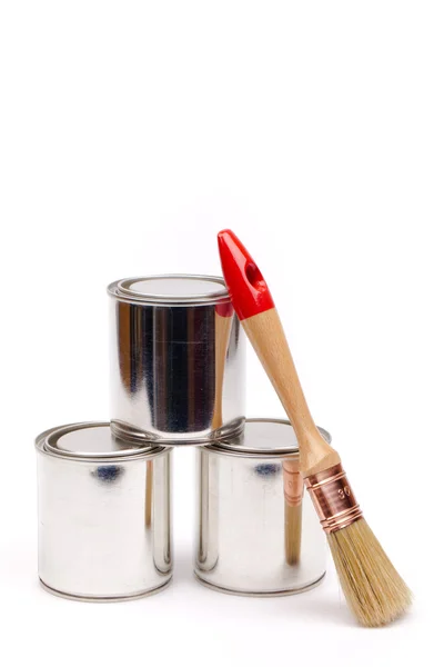 Cans of paint with paintbrushes isolated on white — Stock Photo, Image