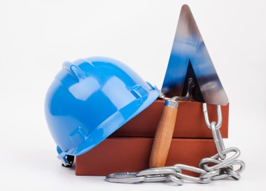 Mavi kask, tuğla ve mason araçları