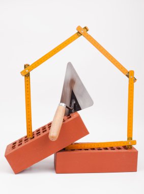 tuğla ve ev sembolü