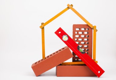 tuğla ve ev sembolü