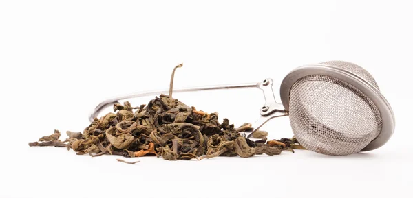 Green tea and tea strainer — Stock Photo, Image