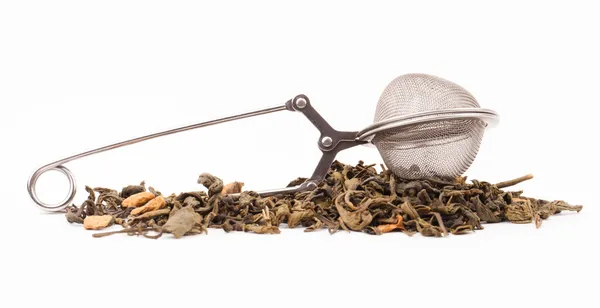 Green tea and tea strainer — Stock Photo, Image