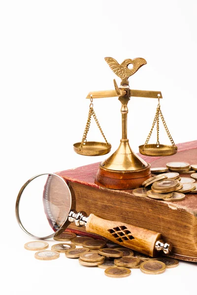 Law book, money, magnifying glass and scales of justice — Stock Photo, Image