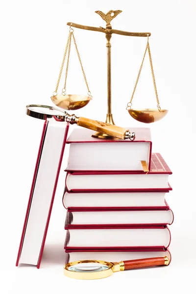 Law book, magnifying glass and scales of justice — Stock Photo, Image