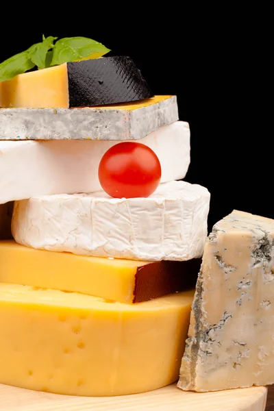 Various types of cheese on wooden table — Stock Photo, Image