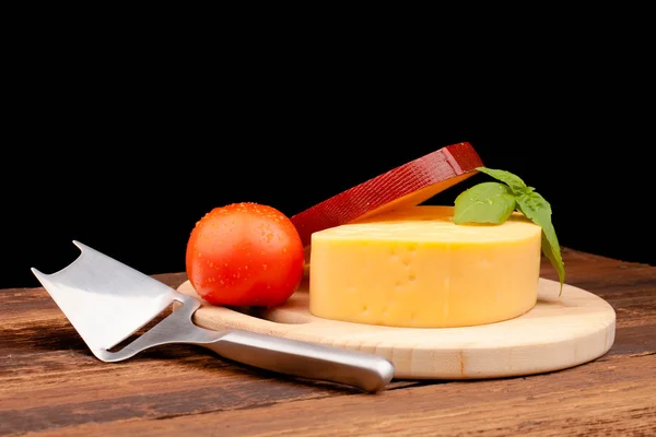 Various types of cheese on wooden table — Stock Photo, Image