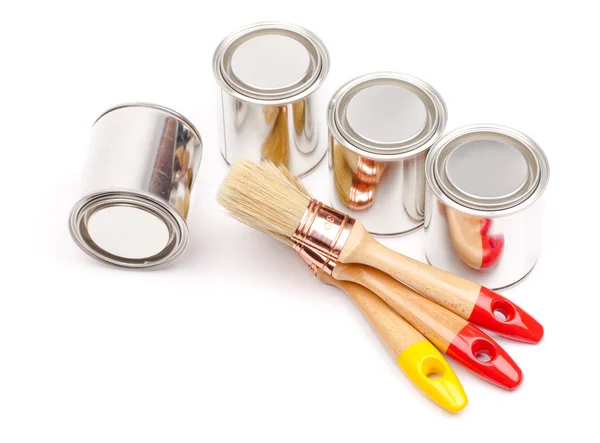 Cans of paint with paintbrushes — Stock Photo, Image