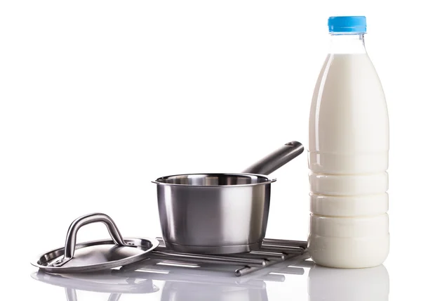 Milk bottle and stainless pot — Stock Photo, Image