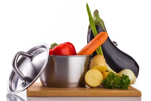 Stainless pot with vegetables isolated on white — Stock Photo, Image