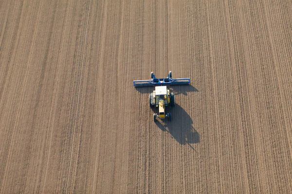 Aerial view of harvest fields with tractor — Stock Photo, Image