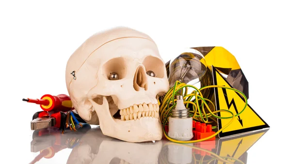 Human skull and electrician's tools — Stock Photo, Image