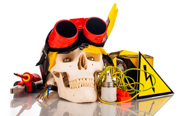 Human skull and electrician's tools — Stock Photo, Image